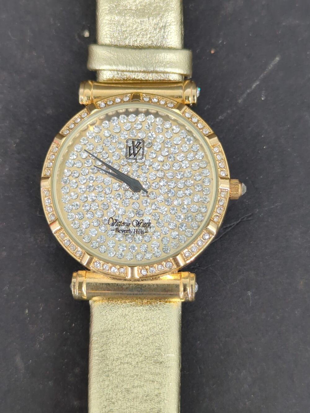 Vtg. Victoria Wieck Beverly Hills Gold Tone Crystal Pave Watch Gold Leather Band